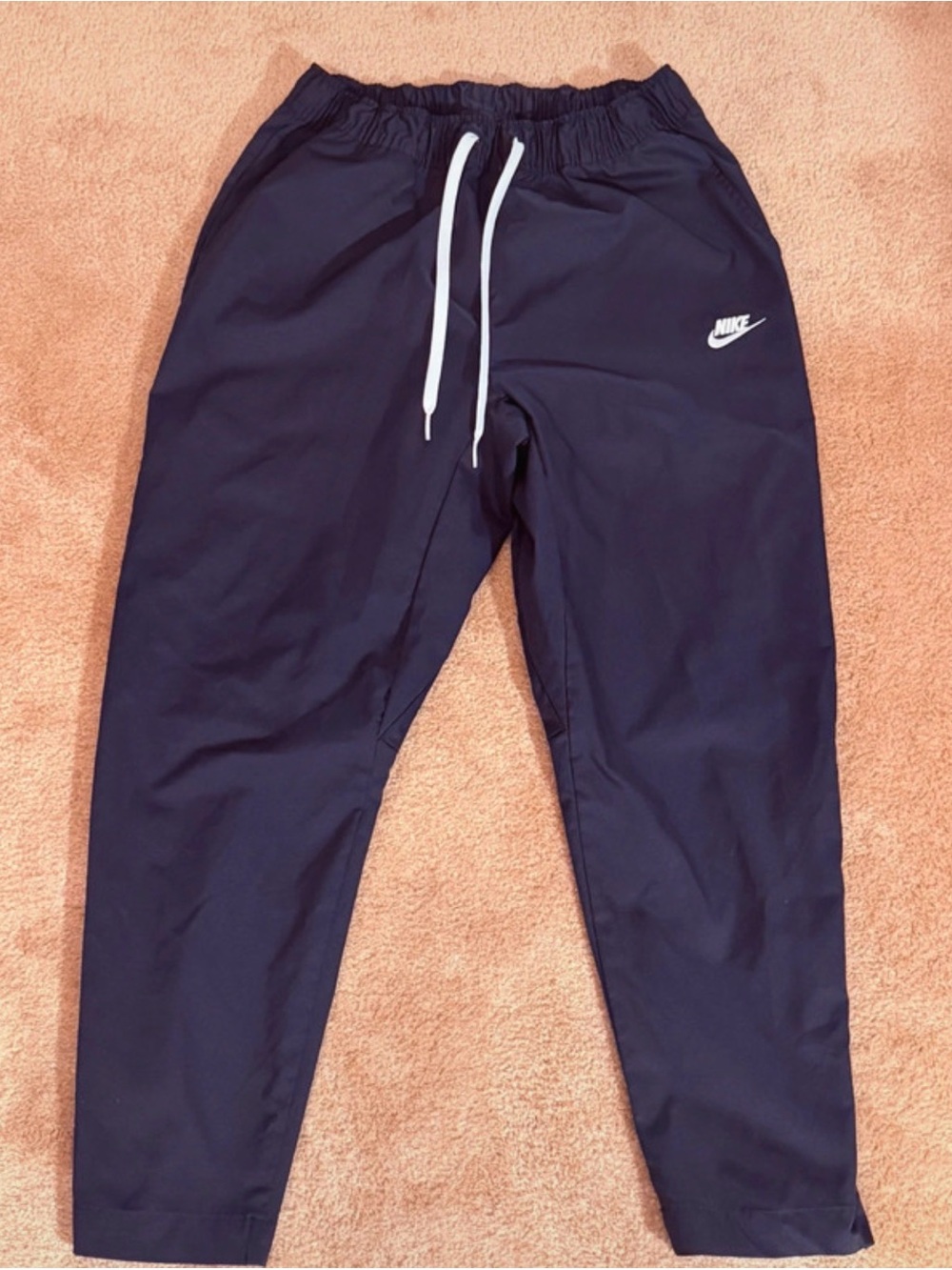 Nike woven track pants.